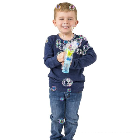 Boy holding bubble gun front view.